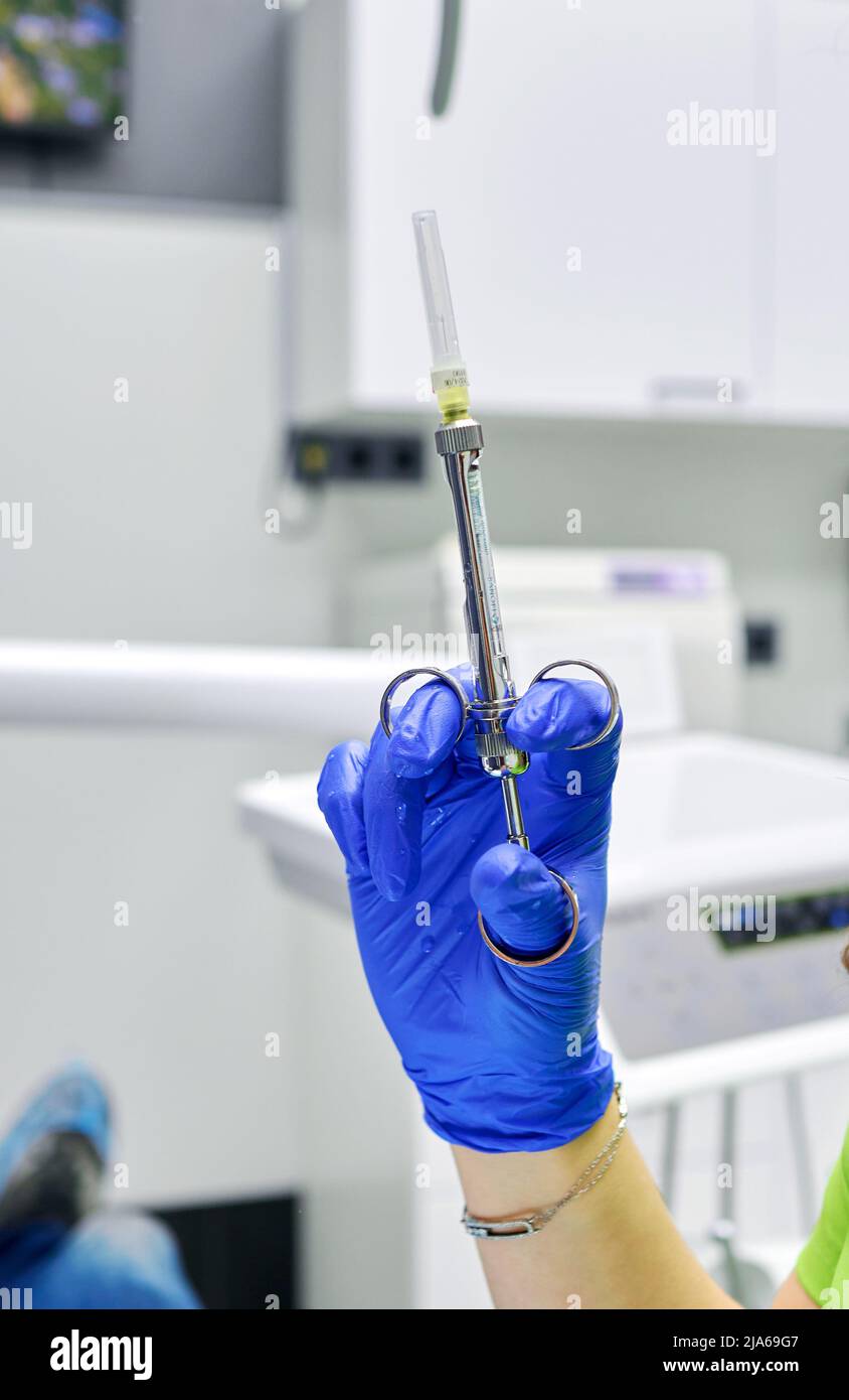syringe in the hands of a dentist Stock Photo Alamy