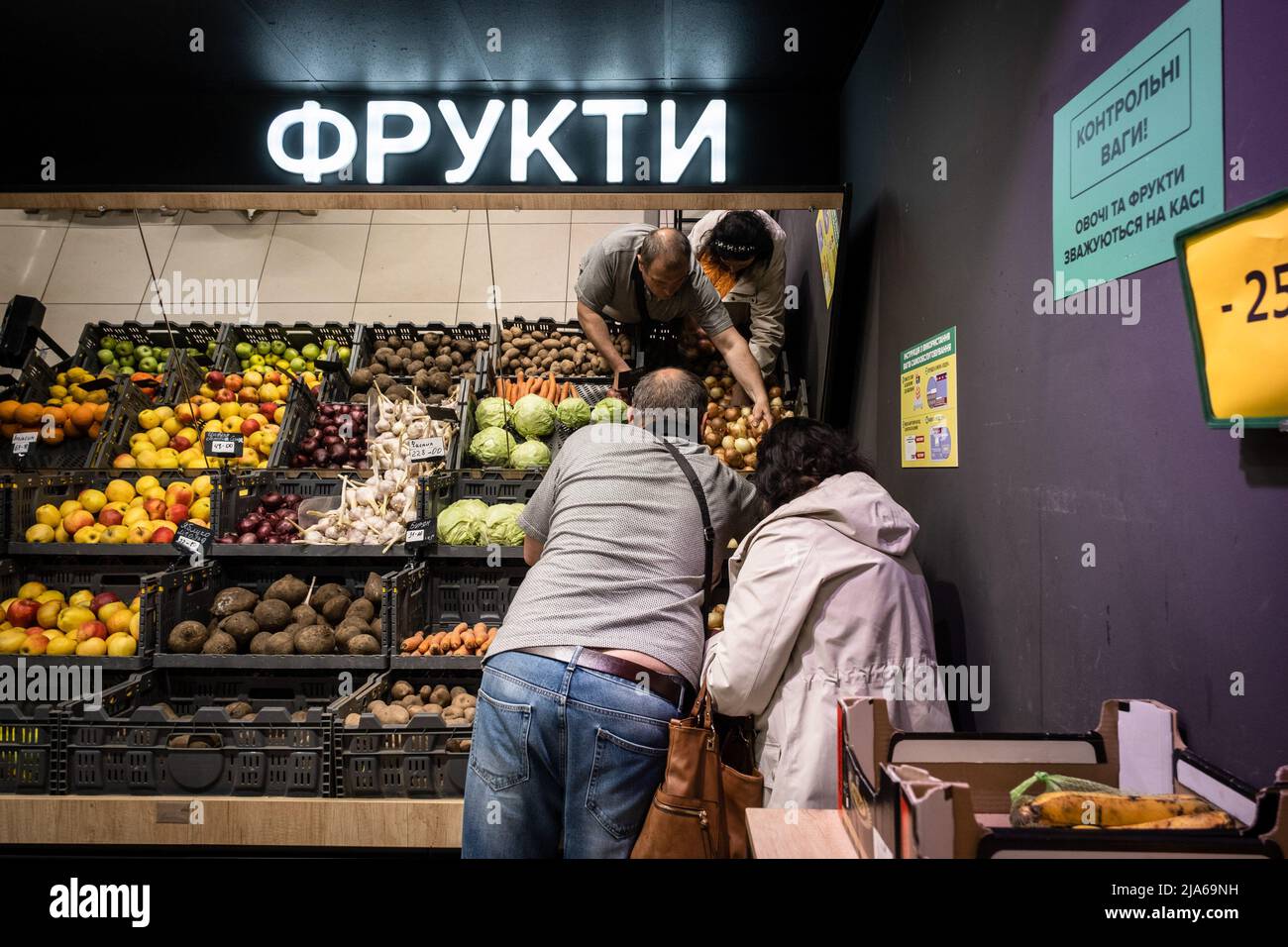 Bakhmut, Ukraine. 24th May, 2022. Husband and wife shop for food in a supermarket in Bakhmut, Donbas. As Bakhmut stands as a key city to Ukrainian forces in defending Donetsk(Donbas) region, the city is under attack by the Russian troops. The Russian invasion of Ukraine started on February 24, the war that has killed numerous civilians and soldiers. Credit: SOPA Images Limited/Alamy Live News Stock Photo