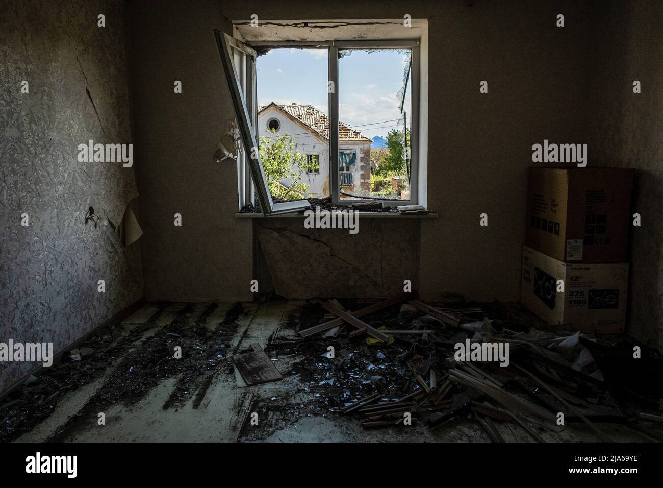 Bakhmut, Ukraine. 24th May, 2022. A view from a room of a residential building destroyed by Russian shelling in Bakhmut, Donbas. As Bakhmut stands as a key city to Ukrainian forces in defending Donetsk(Donbas) region, the city is under attack by the Russian troops. The Russian invasion of Ukraine started on February 24, the war that has killed numerous civilians and soldiers. Credit: SOPA Images Limited/Alamy Live News Stock Photo