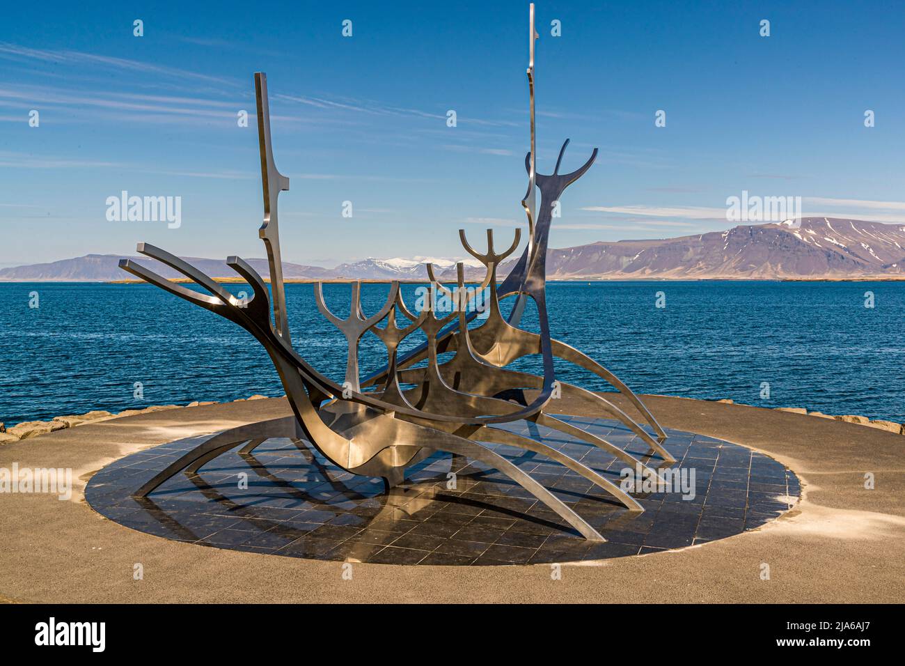 Sun Voyager. Huge 1990 stainless-steel sculpture of a boat by Jón Gunnar Árnason, set on granite beside the sea. Reykjavik, Iceland Stock Photo