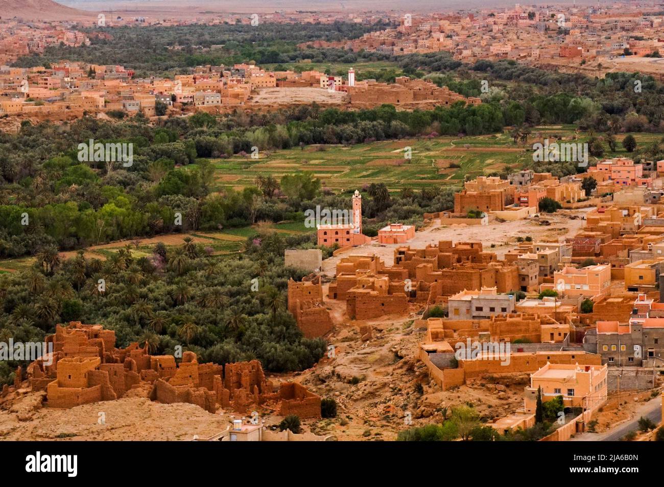 Desert Oasis with medieval city buildings around near the highest canyon Stock Photo
