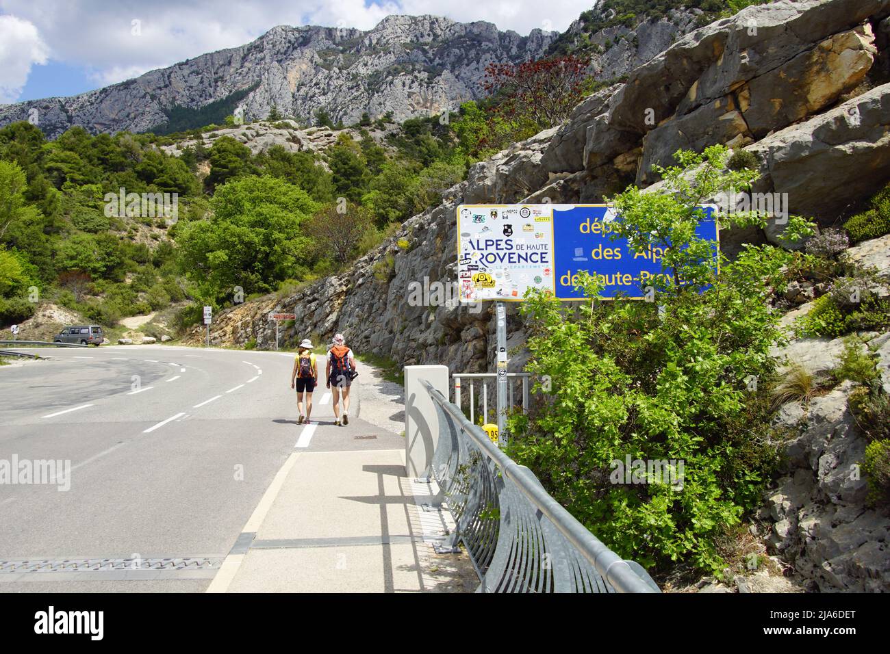 Lake of Sainte-Croix, France - April 28, 2022: Unknown and unrecognizable people walking by France Alpes-de-Haute-Provence department entrance sign. Stock Photo