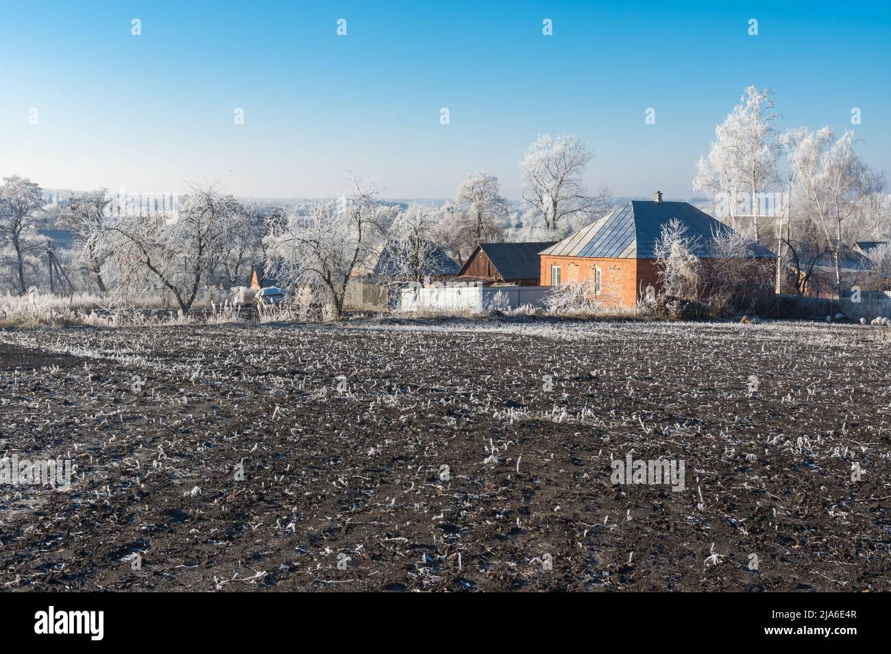 Pecefull lanscape with peasant houses at winter seaon  sin boromlya village in sumskaya oblast, Ukraine Stock Photo