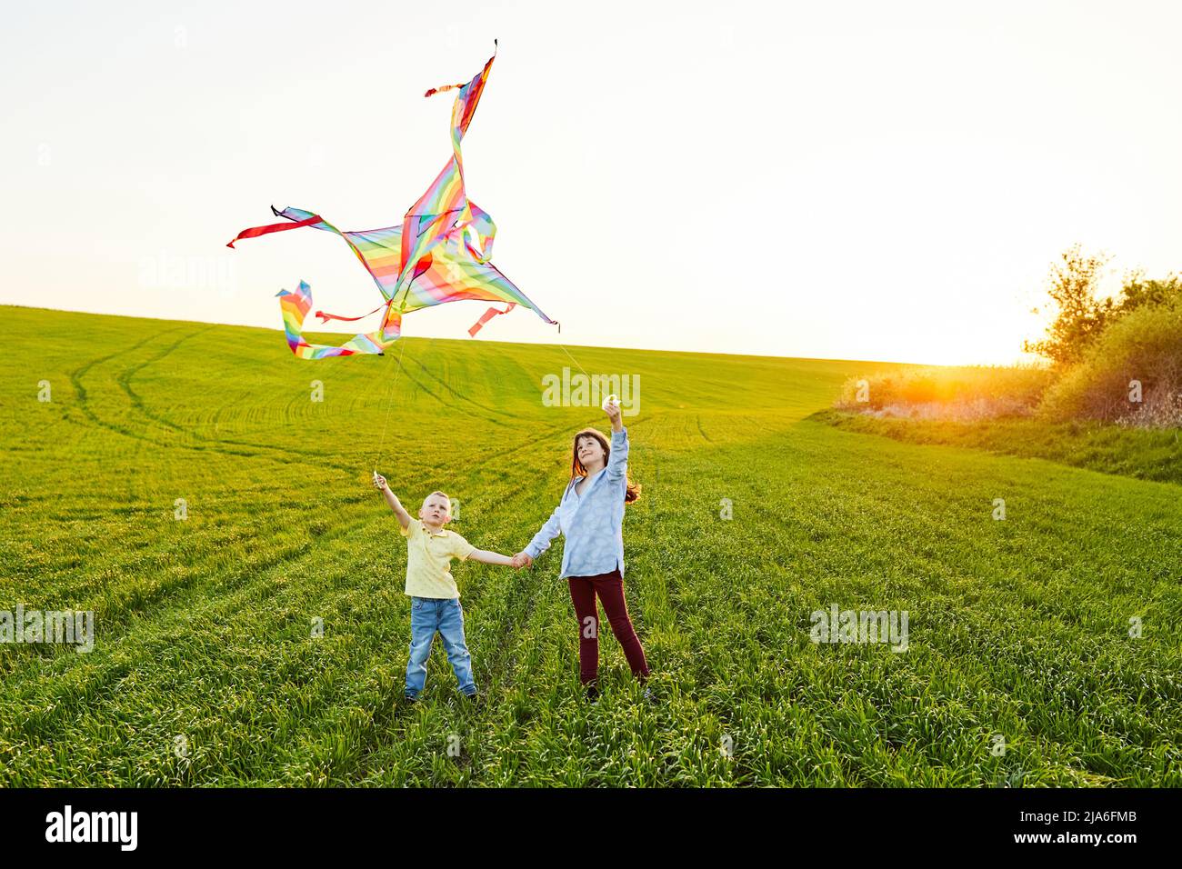 Premium Photo  Little boy and girl play in field kids in summer meadow  family vacation in the country siblings love