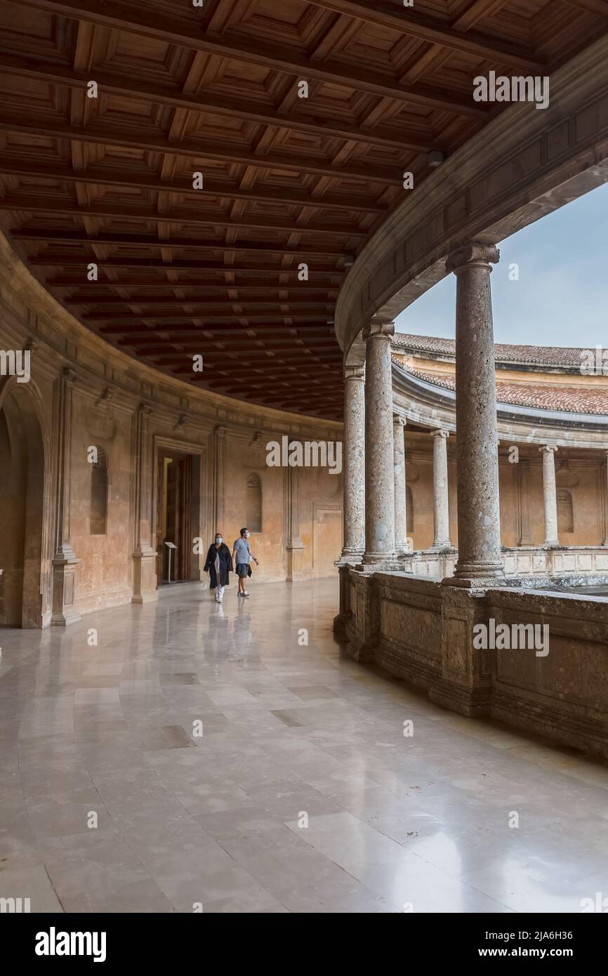 Granada Spain - 09 14 2021: Interior circular Patio on Charles V Palace, Doric and stylized Ionic colonnade of conglomerate stone, Renaissance buildin Stock Photo