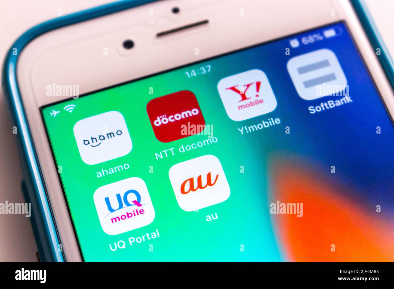 Kumamoto, JAPAN - Dec 4 2020 : 3 top Japanese mobile carriers (au by KDDI, NTT & SoftBank) with their subsidiary Ahamo, Y!mobile, UQ Mobile on iPhone. Stock Photo