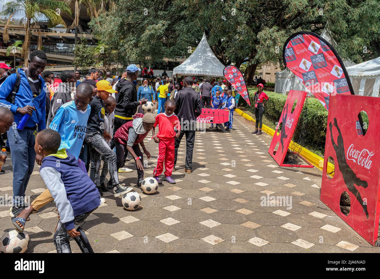 People arrive at the Kenyatta International Convention Centre (K.I.C.C) for a historic moment during the FIFA World Cup tour and public viewing in Nairobi. The FIFA World Cup trophy landed in Kenya for a two-day tour including public viewing ahead of this year's World Cup in Qatar. Stock Photo