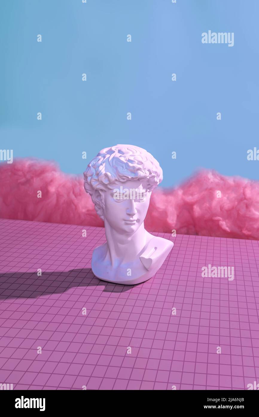 Michelangelo's David in the virtual cyberpunk metaverse. Minimal concept of future and digital innovation in pastel color trend color. Stock Photo