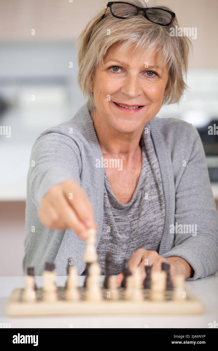 Woman board game looking at camera hi-res stock photography and images ...