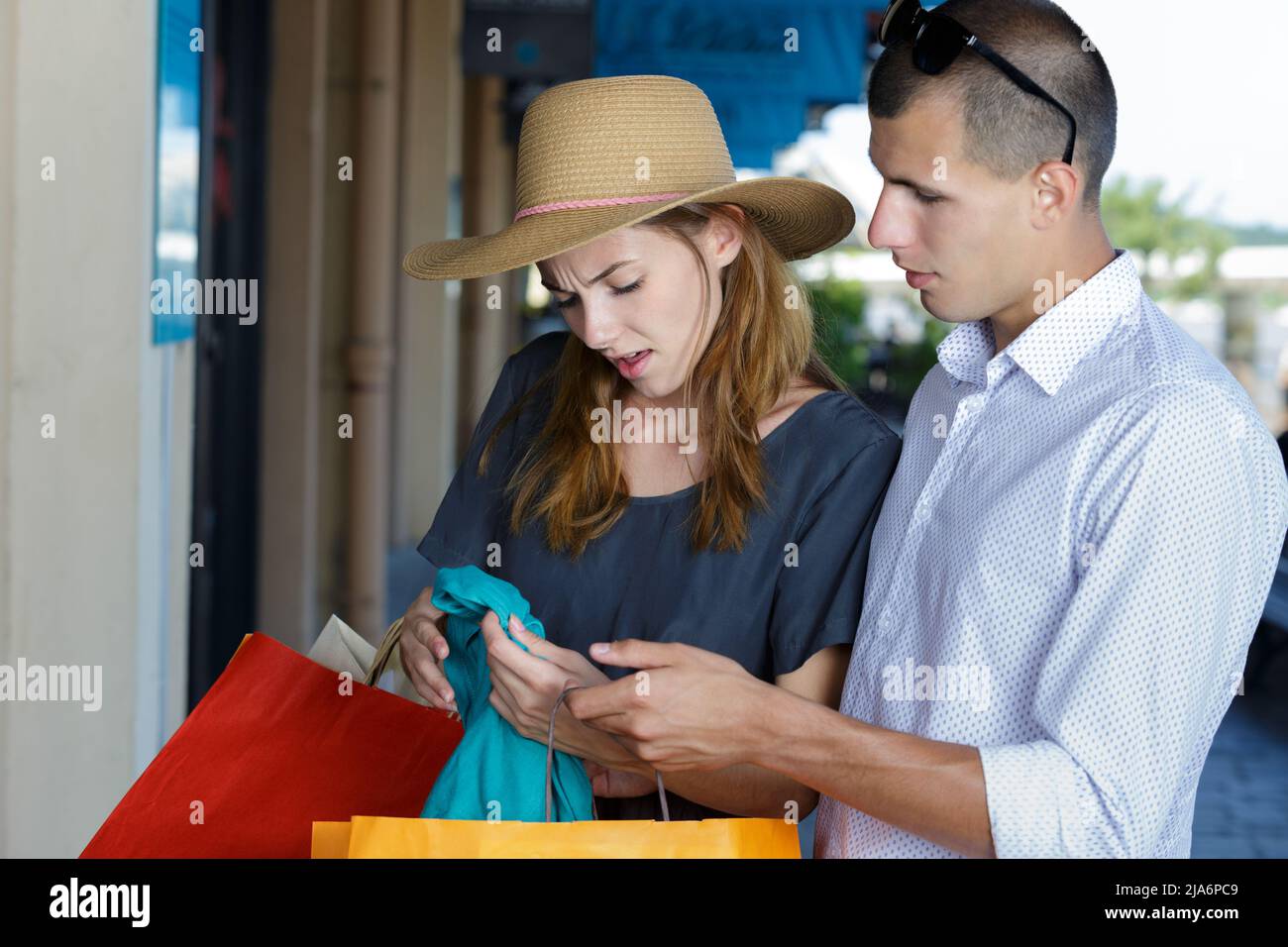 customers noticing a damage in the product they just bought Stock Photo ...