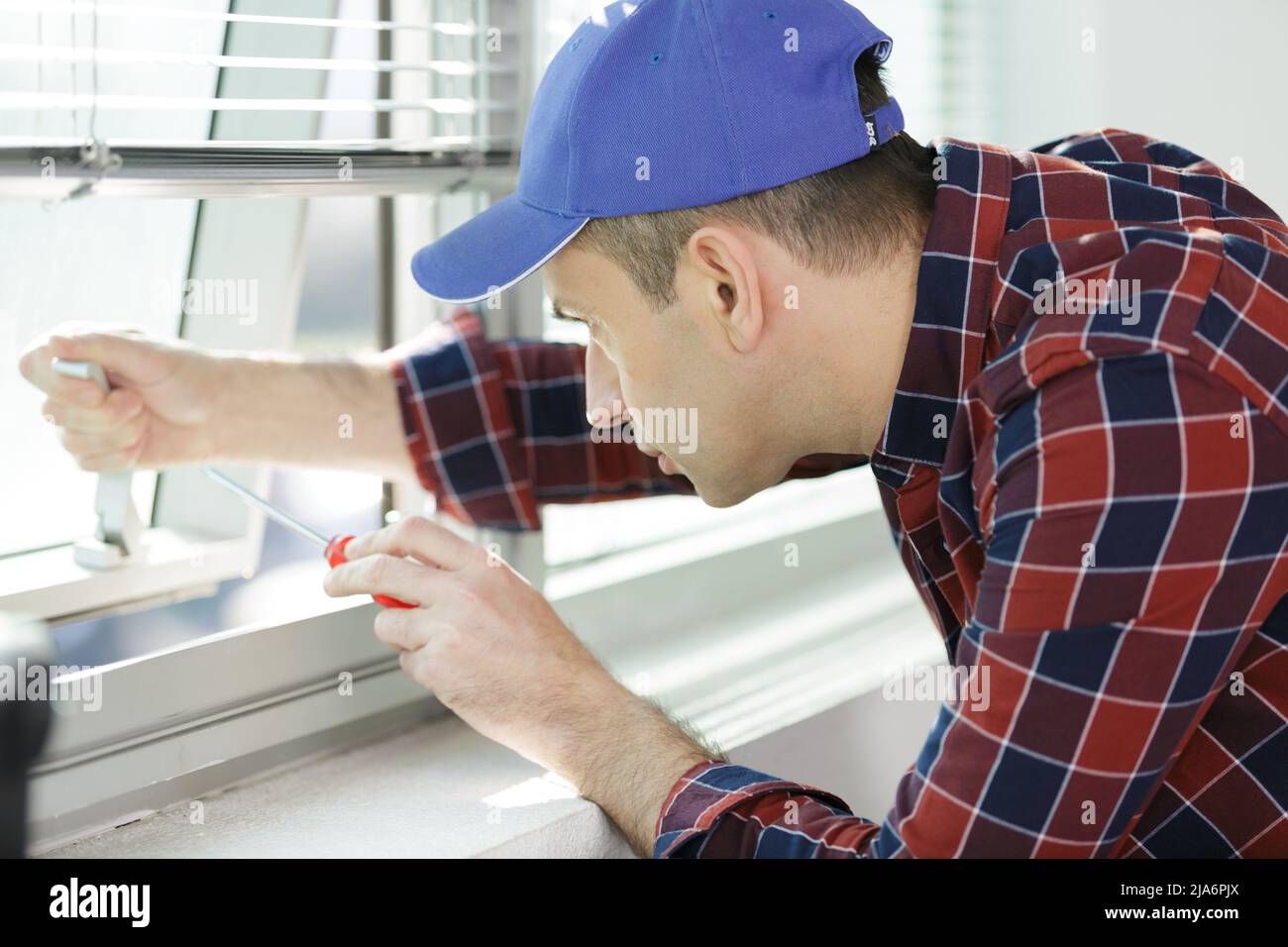 a specialist in installing plastic windows Stock Photo