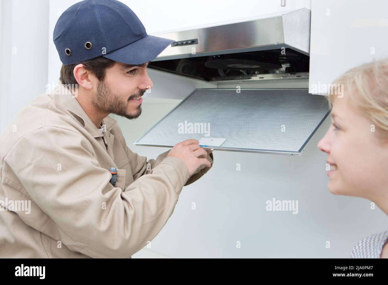 Stove Exhaust Fan Extractor Filter Maintenance And Change Stock Photo -  Alamy