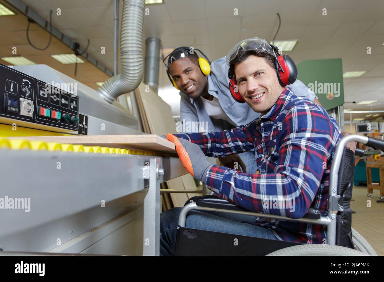 handicapped worker and colleague in a carpentry workshop Stock Photo ...