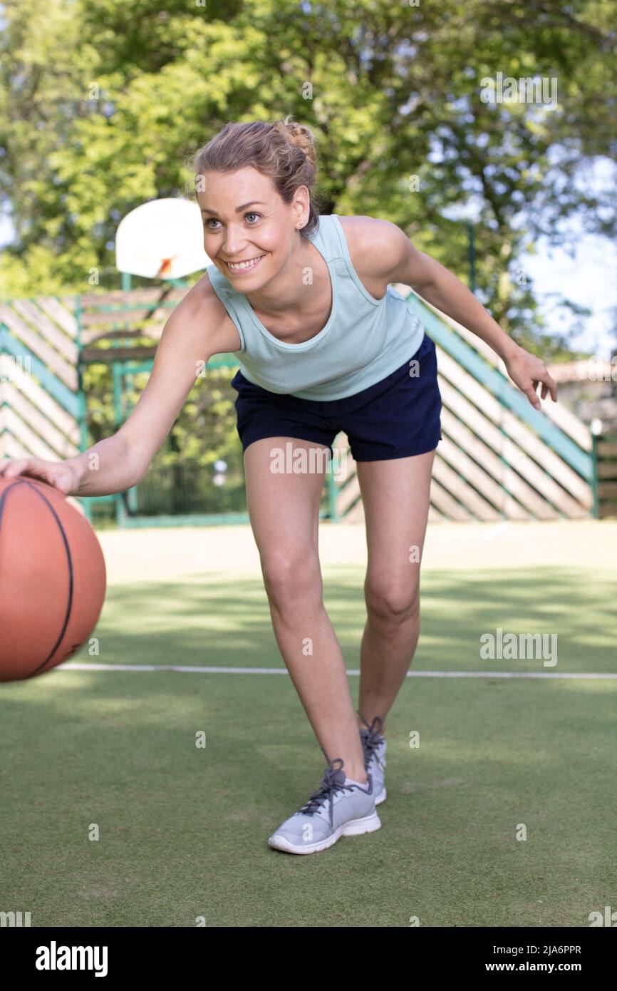 young girl playing basketball outside Stock Photo Alamy