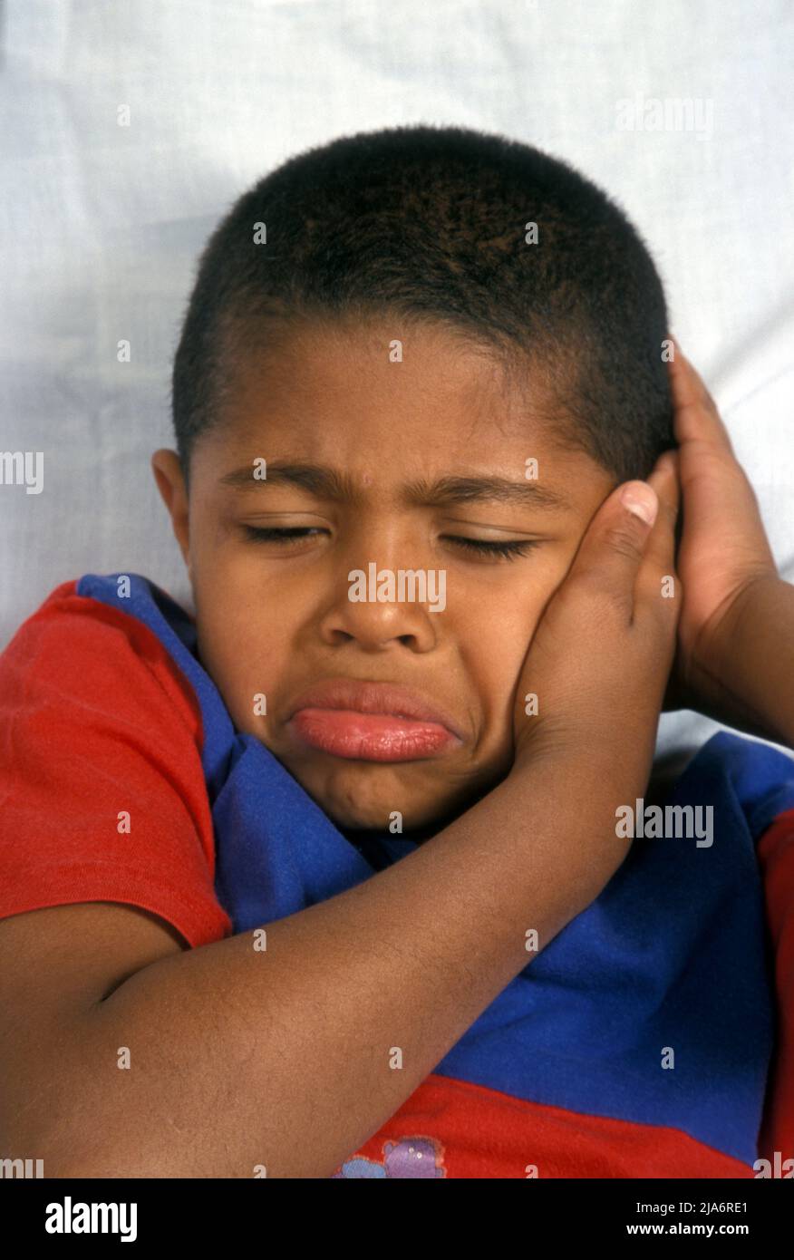 young black boy with tooth or earache Stock Photo