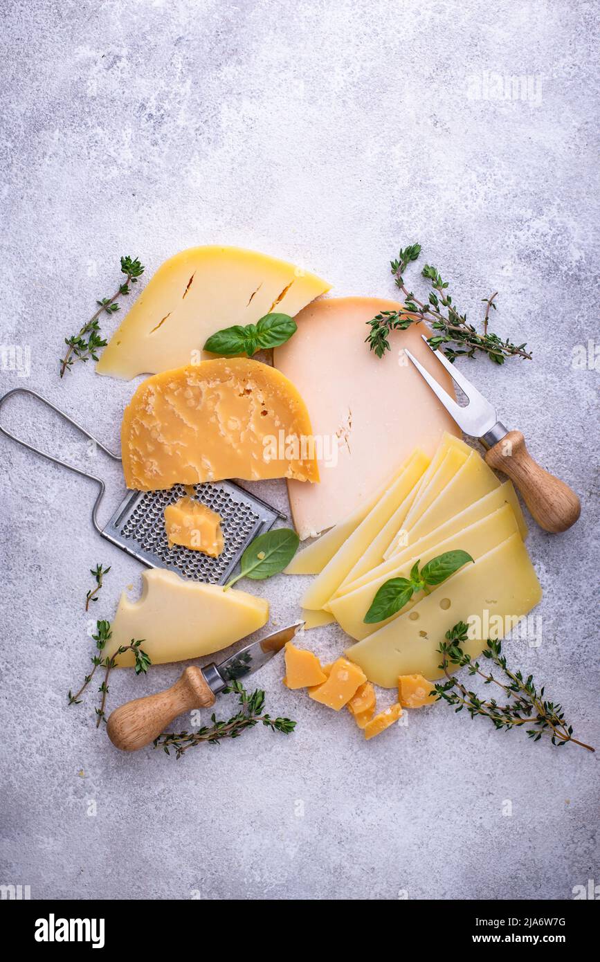 Parmesan, cheddar, gouda and maasdam cheese Stock Photo Alamy