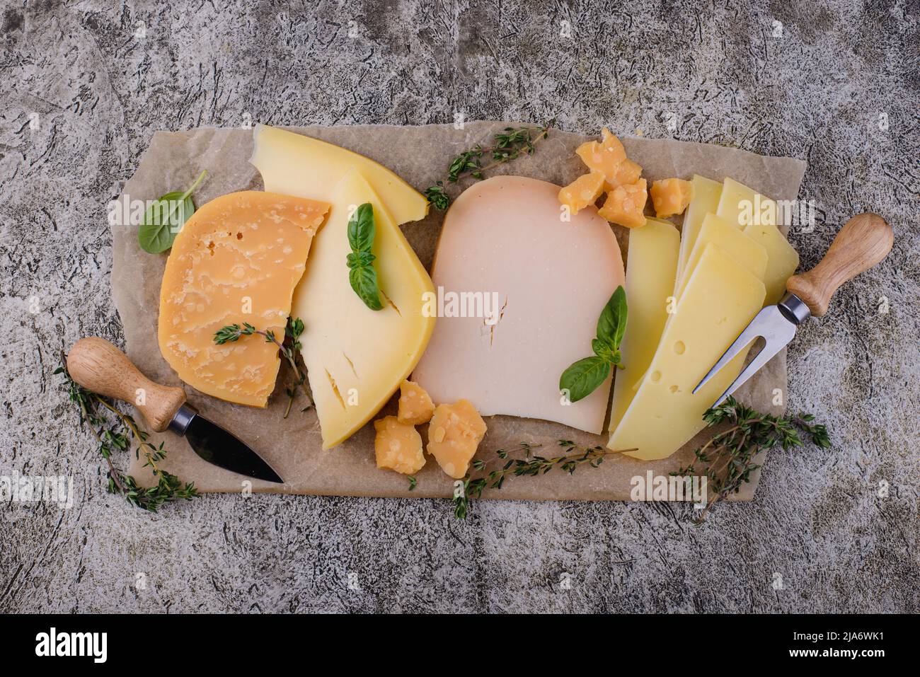 Parmesan, cheddar, gouda and maasdam cheese Stock Photo Alamy
