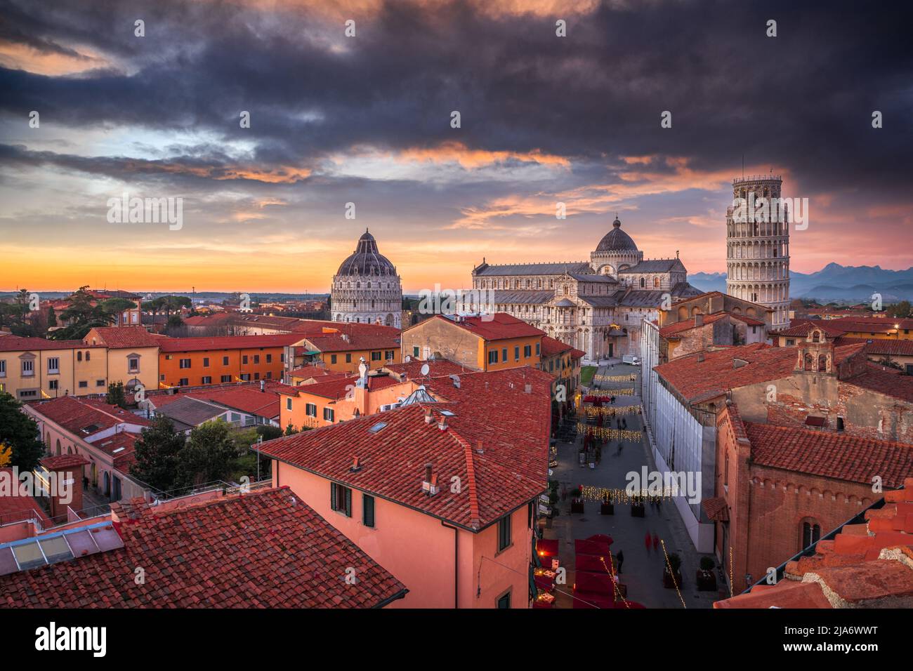 Pisa, Italy old town skyline with the cathedral and tower at dusk. Stock Photo