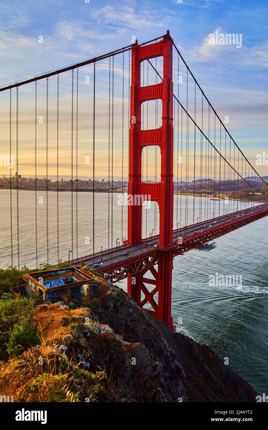 Glorious sunrise light hitting red Golden Gate Bridge in San Francisco Stock Photo