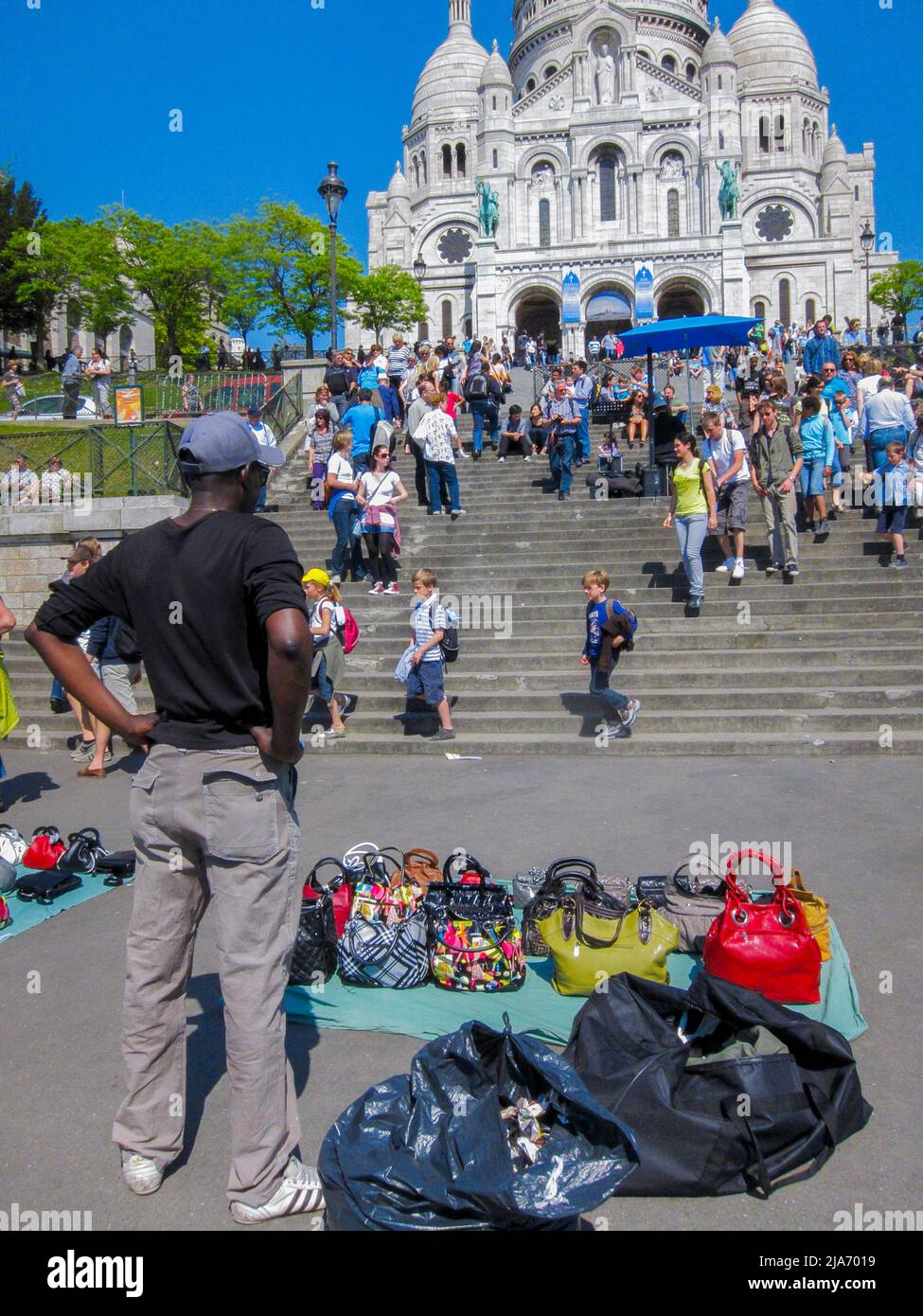 Paris, France, African Street Vendors, Selling Bags, Large Crowd People, Tourists Visiting Montmartre, Sacre Coeur Basilique Church, Historic Monument Stock Photo