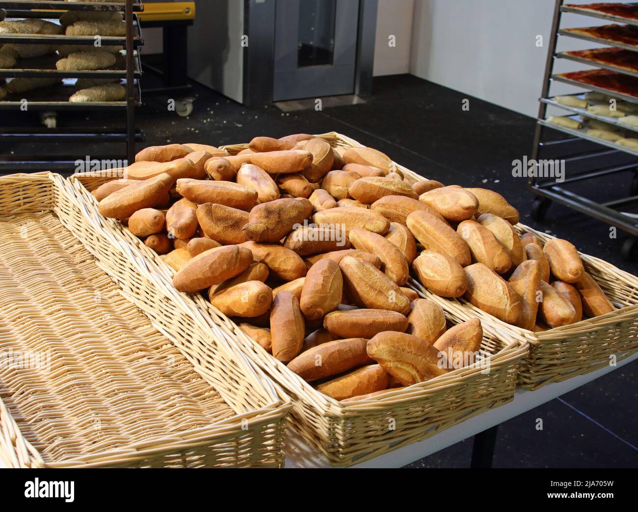 many loaves of freshly baked fragrant bread in the parisian bakery in