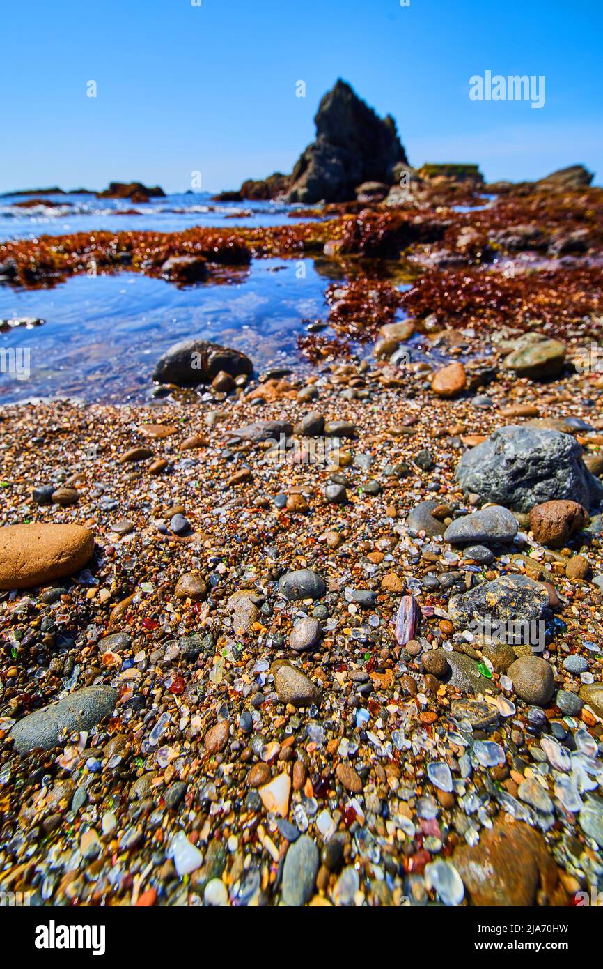Glass Beach in California with shiny and colorful rocks Stock Photo