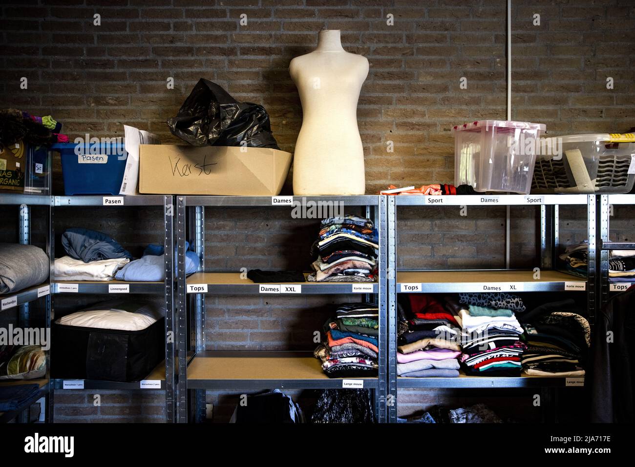 2022-05-28 10:43:13 EGMOND AAN DEN HOEF - Clothes that have just arrived at  Clothing Bank Noord-Holland Noord. Started as a clothing bank, food is now  also distributed to people who are in