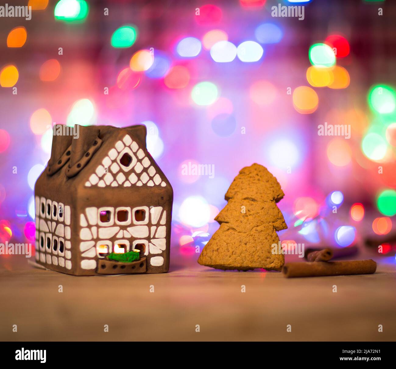 fairy Christmas house cake with candle light inside, narrow depth of