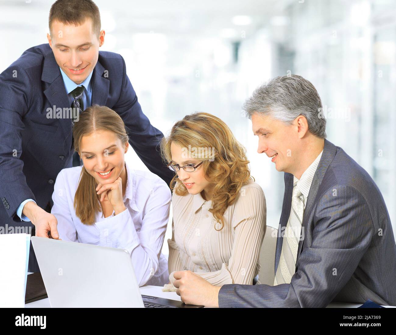 Business people sitting at corporate meeting Stock Photo
