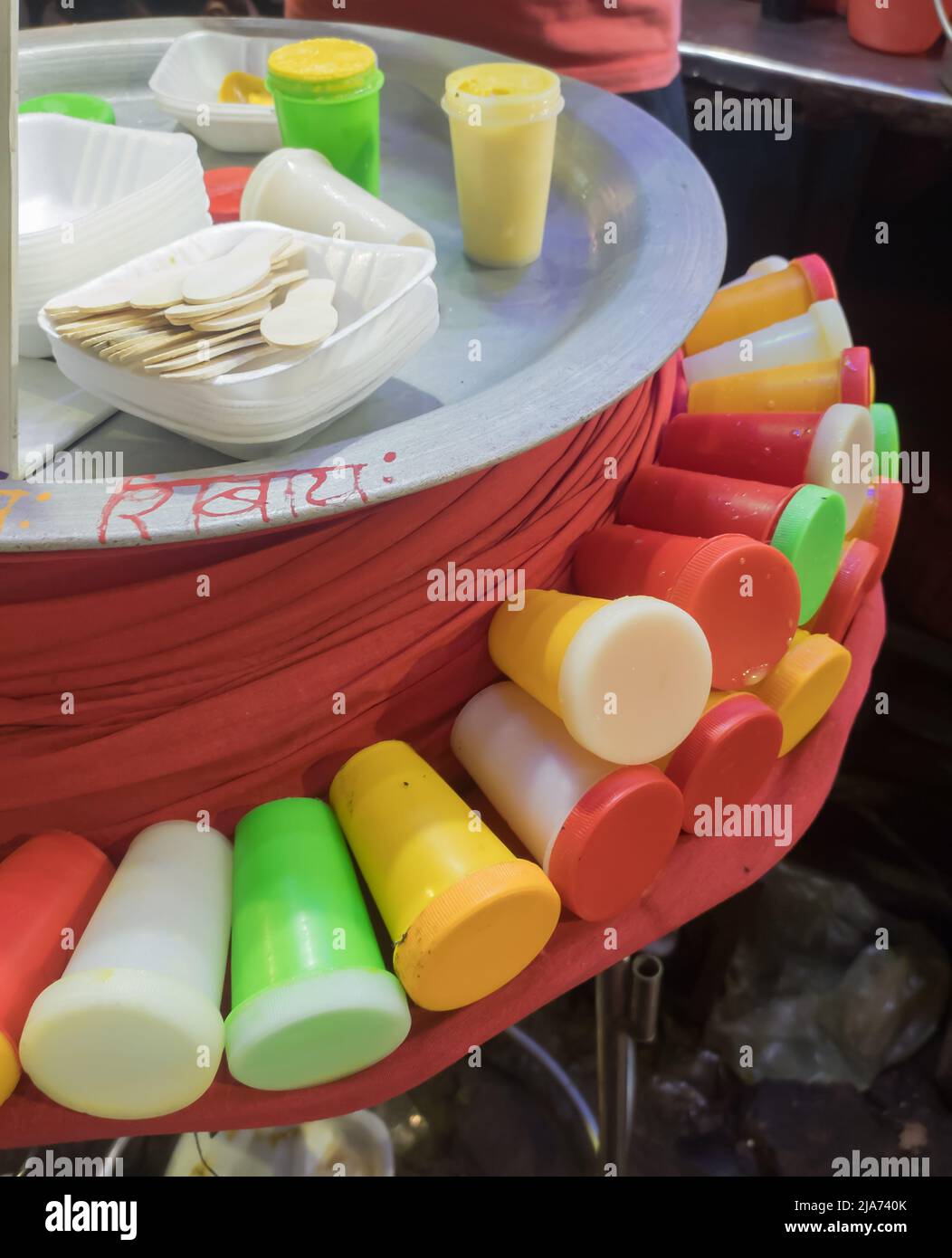 kulfi is a frozen dairy dessert being sold in a market of india