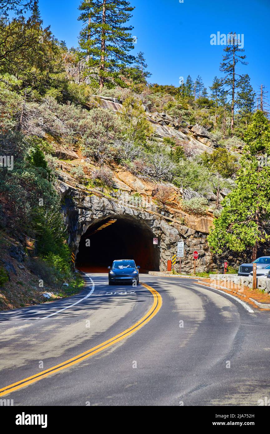 Car entering Yosemite National Park through mile long tunnel Stock