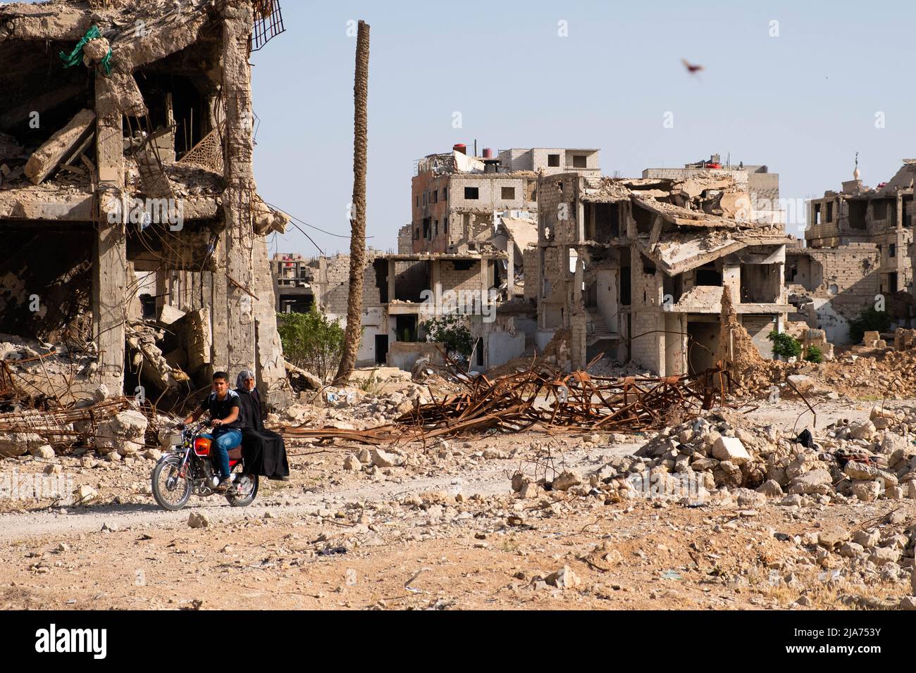 Darayya, Syria - April, 2022: People in destroyed city of Darayya after the Syrian Civil War. Stock Photo