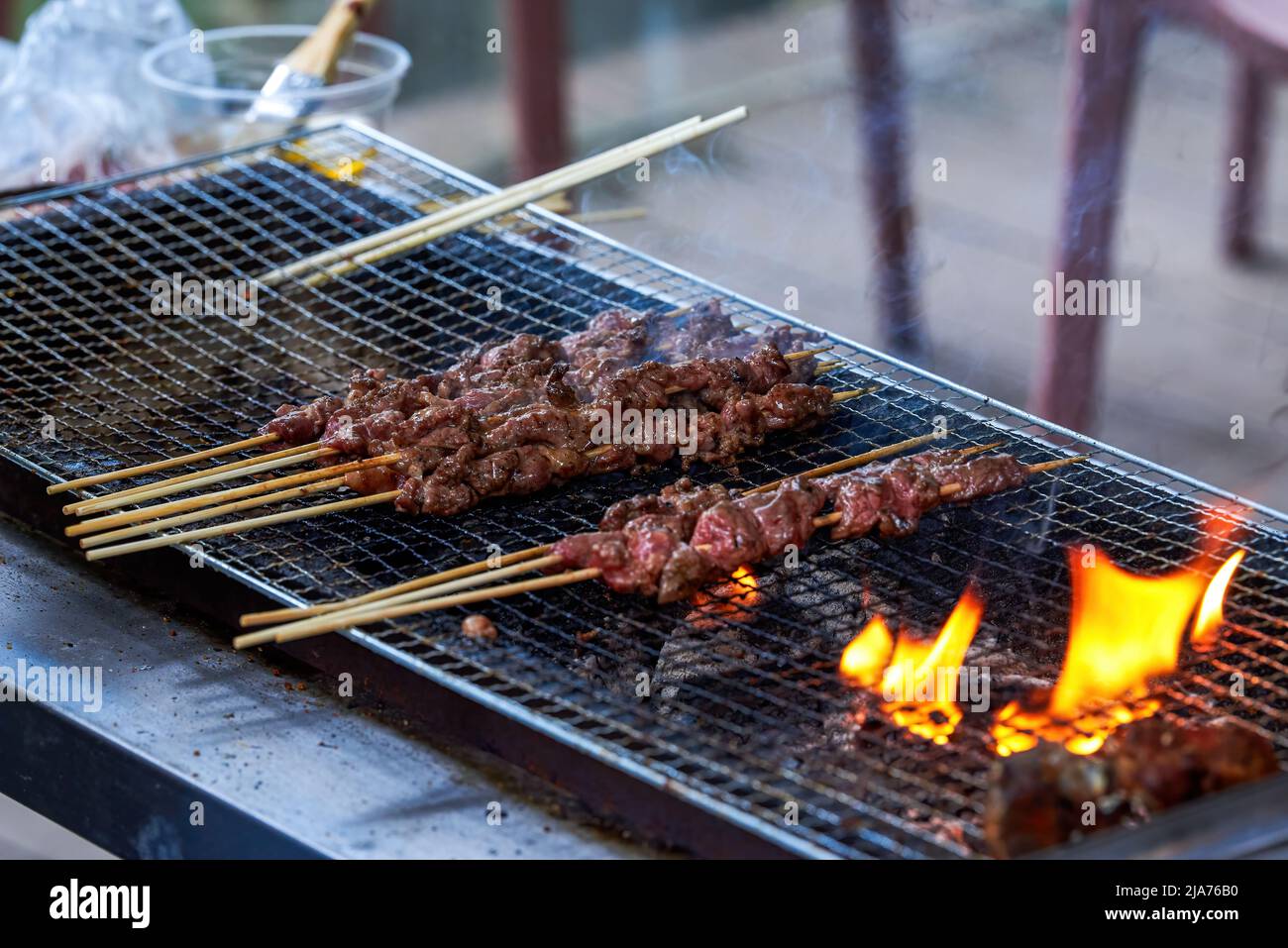 A person is making barbecue, charcoal kebab Stock Photo - Alamy