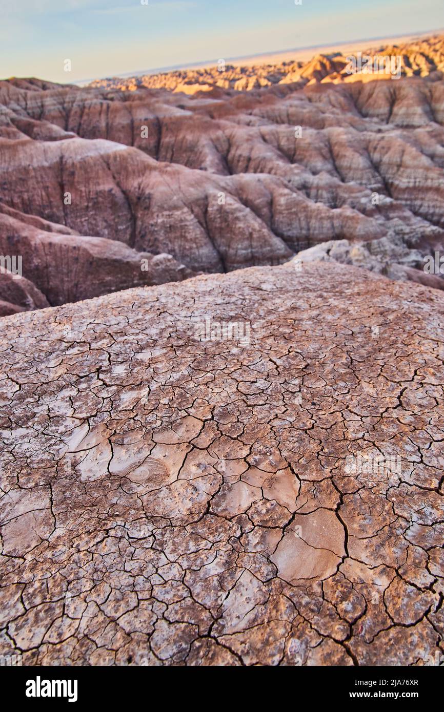 Cracked desert grounds of Badlands sediment layers Stock Photo