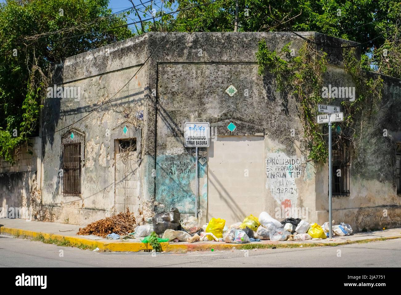Garbage dump on a street corner, Merida Mexico Stock Photo