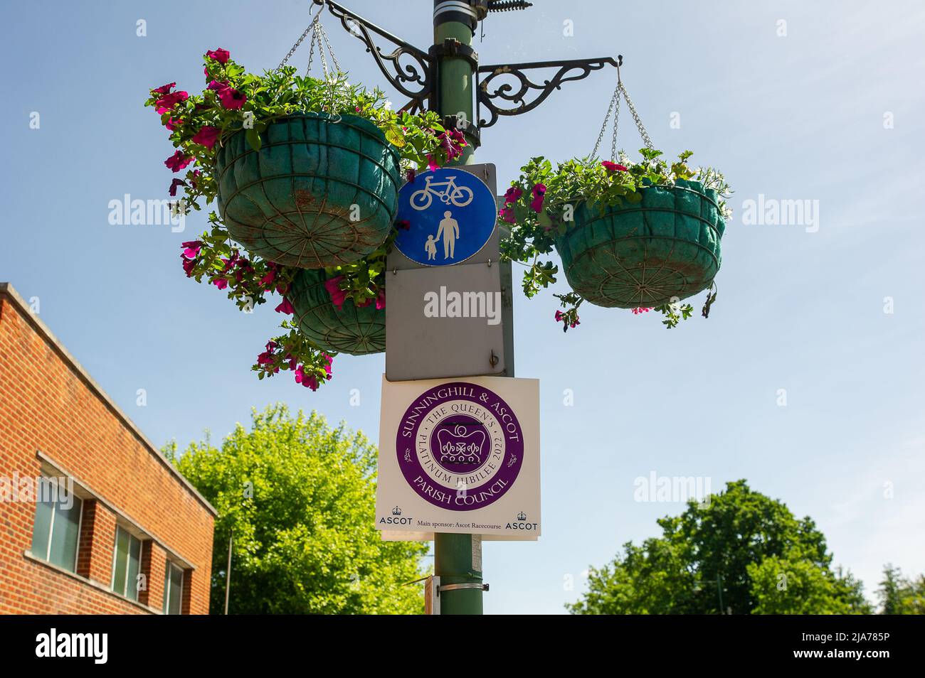 Ascot, Berkshire, UK. 27th May, 2022. Signs celebrating Her Majesty the Queen's Platinum Jubilee have been put on lamposts along Ascot High Street by Sunninghill and Ascot Parish Council. A Platinum Party in the Park will be taking place on Sunninghill on 2nd June. Credit: Maureen McLean/Alamy Stock Photo