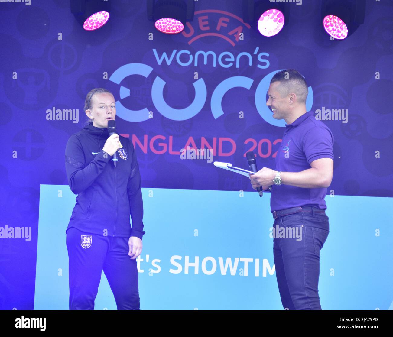 Manchester, UK, 28th May, 2022. England Women winger Emma Brown being interviewed on the stage. A national roadshow celebrating UEFA Women’s EURO 2022 arrives at the Football Museum in Manchester, England, UK. Supported by the BBC it offers a chance to learn new football skills. Organisers said: 'Get down to Cathedral Gardens to get photos with the trophy, take part in activities, witness amazing skills demos and hear from star speakers.' The roadshow will make 10 stops in the UK. Credit: Terry Waller/Alamy Live News Stock Photo