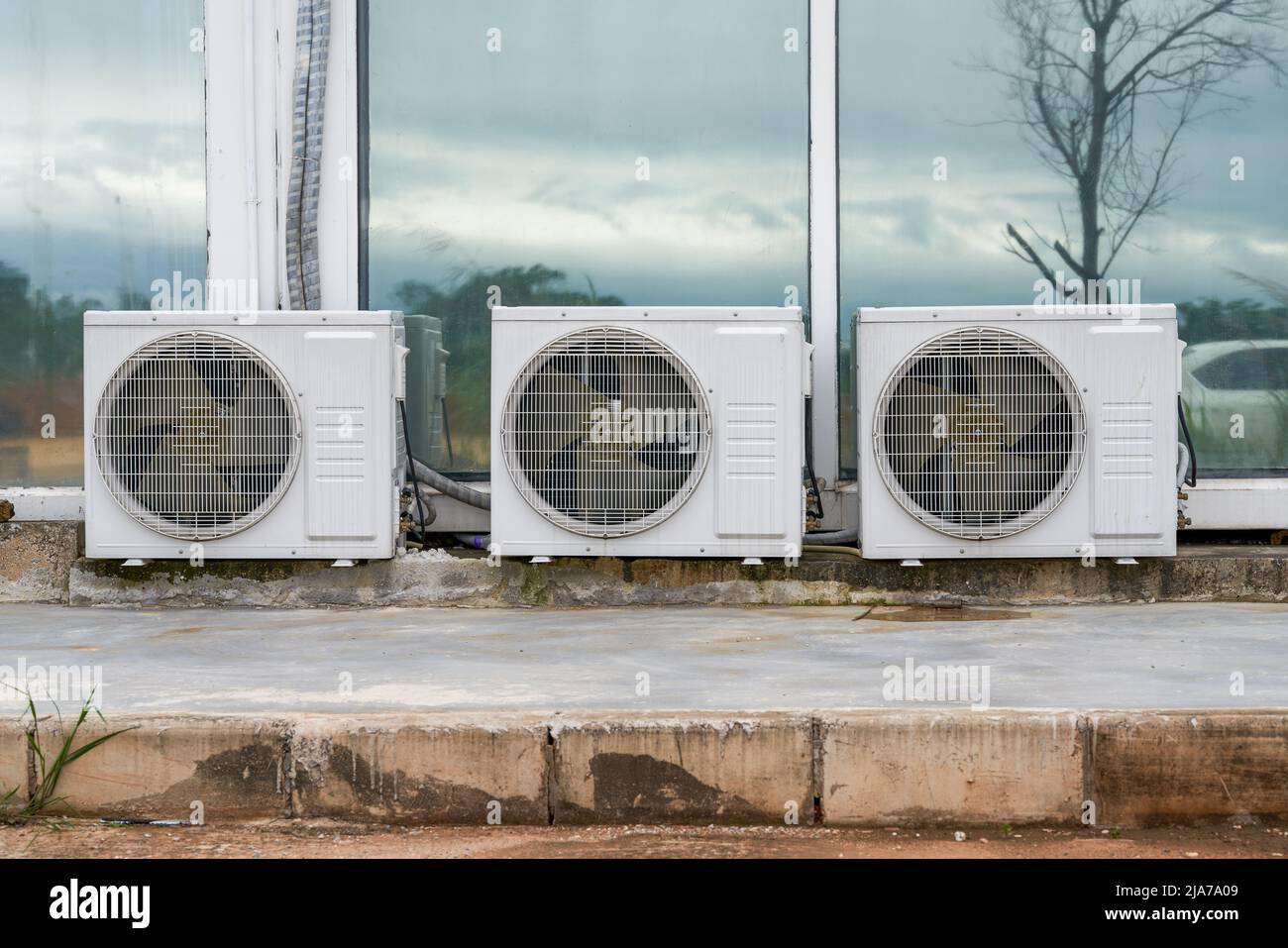 Closeup of three air conditioner outdoor units Stock Photo Alamy