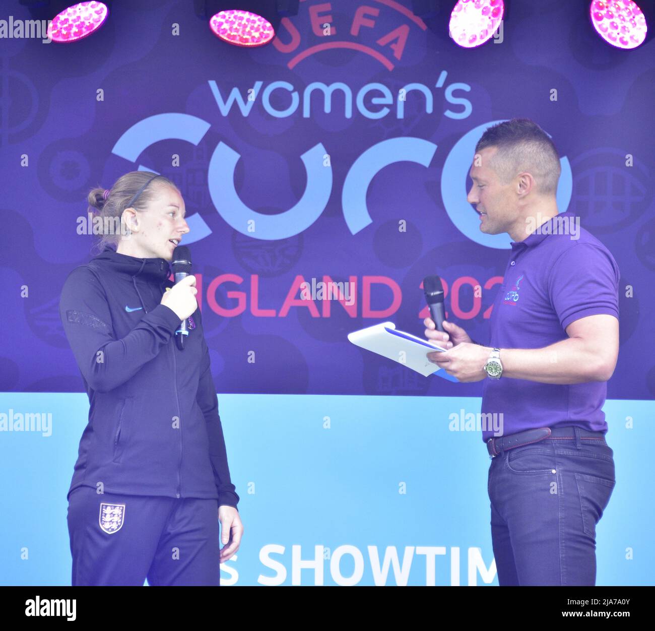 Manchester, UK, 28th May, 2022. England Women winger Emma Brown being interviewed on the stage. A national roadshow celebrating UEFA Women’s EURO 2022 arrives at the Football Museum in Manchester, England, UK. Supported by the BBC it offers a chance to learn new football skills. Organisers said: 'Get down to Cathedral Gardens to get photos with the trophy, take part in activities, witness amazing skills demos and hear from star speakers.' The roadshow will make 10 stops in the UK. Credit: Terry Waller/Alamy Live News Stock Photo