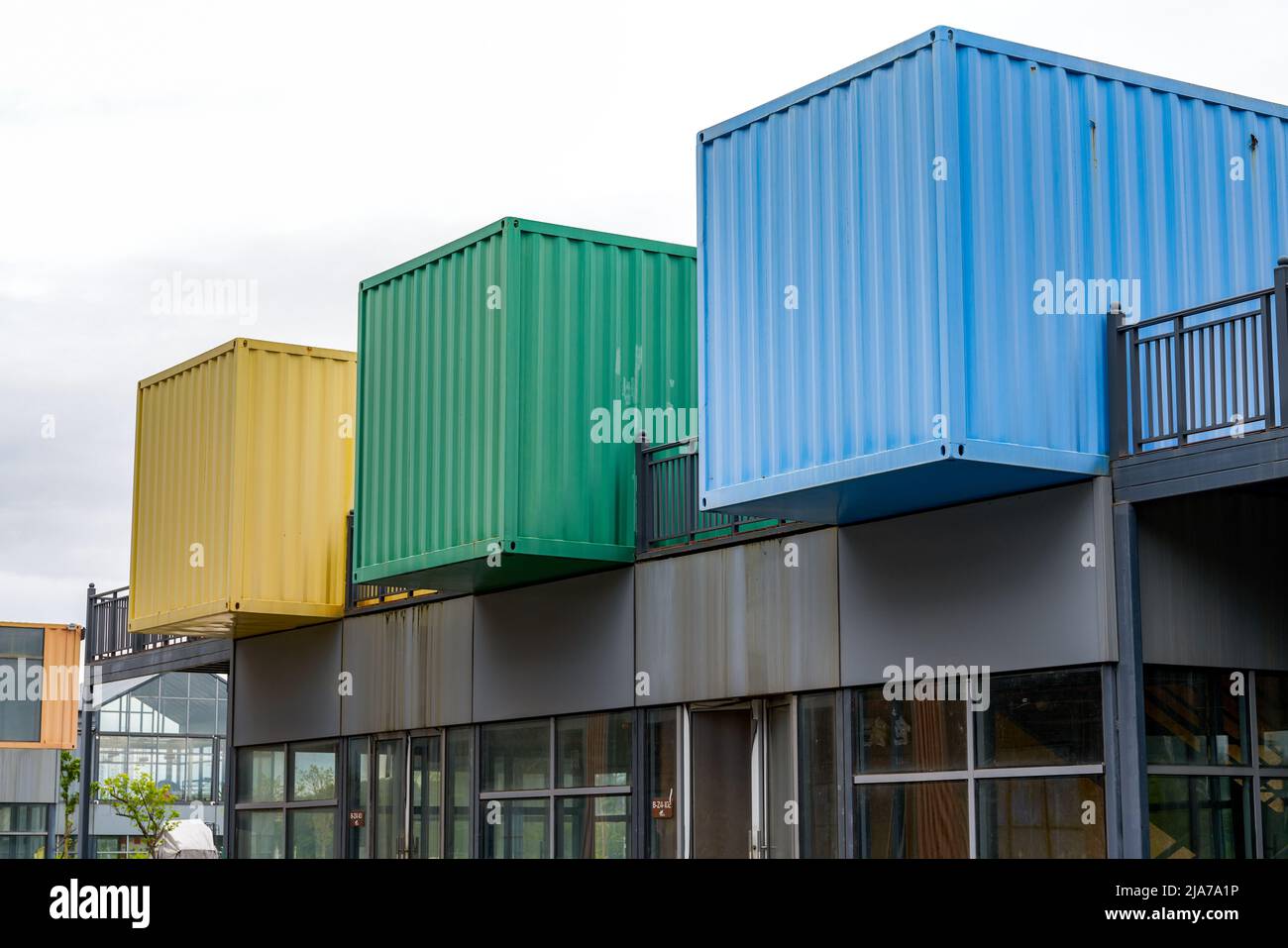 Three colored shipping containers make residential buildings Stock Photo Alamy