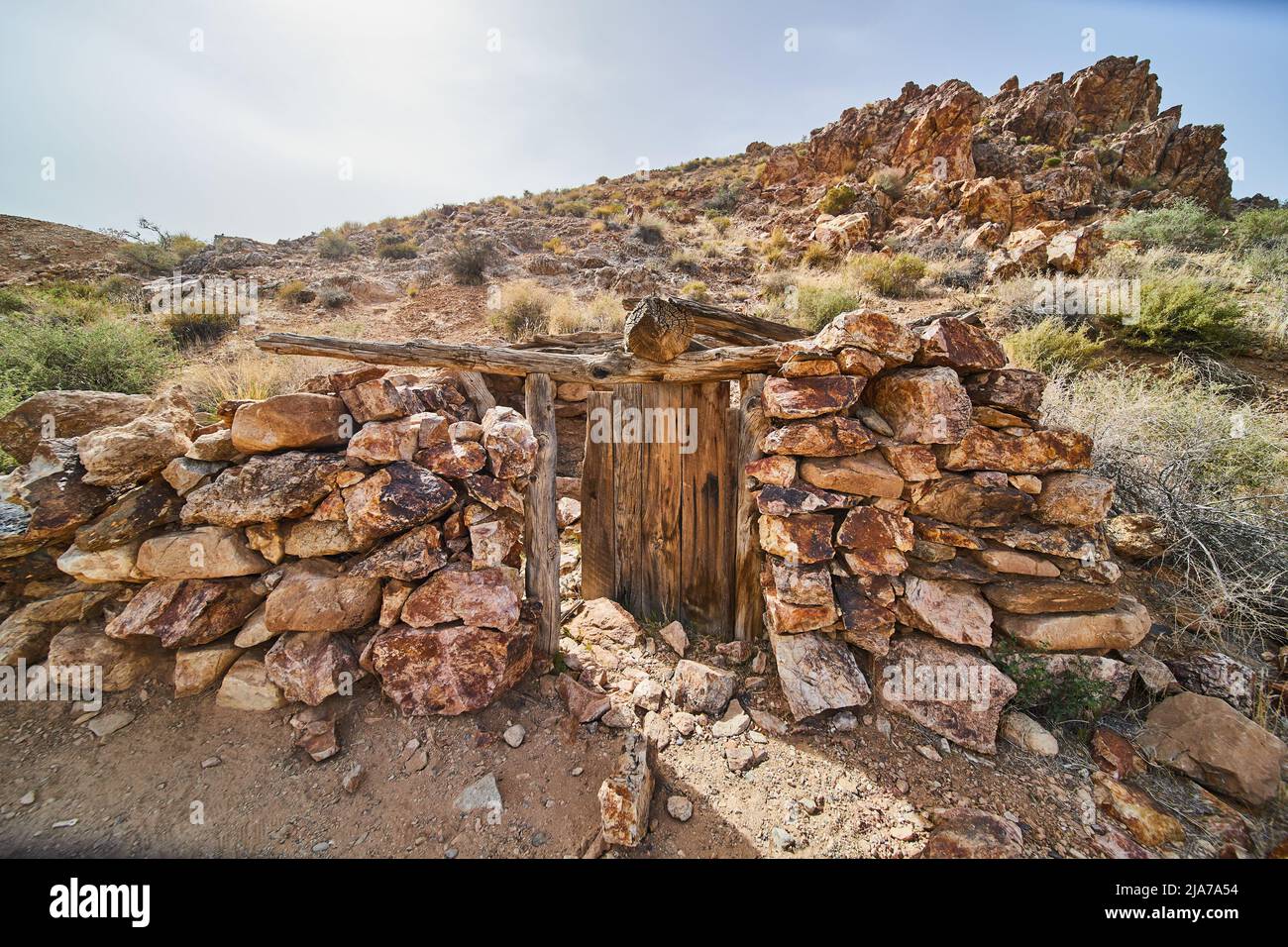 Desert hills with abandoned stone structure by old mine Stock Photo Alamy