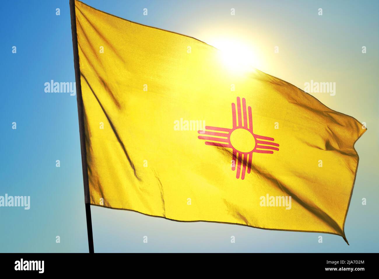 New Mexico state of United States flag waving on the wind Stock Photo