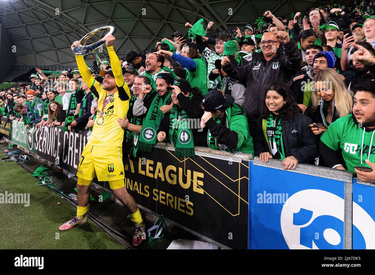 Melbourne, Australia, 28 May, 2022. Ryan Scott of Western United celebrates with the trophy and fans during the A-League Grand Final soccer match between Melbourne City FC and Western United at AAMI Park on May 28, 2022 in Melbourne, Australia. Credit: Mikko Robles/Speed Media/Alamy Live News Stock Photo