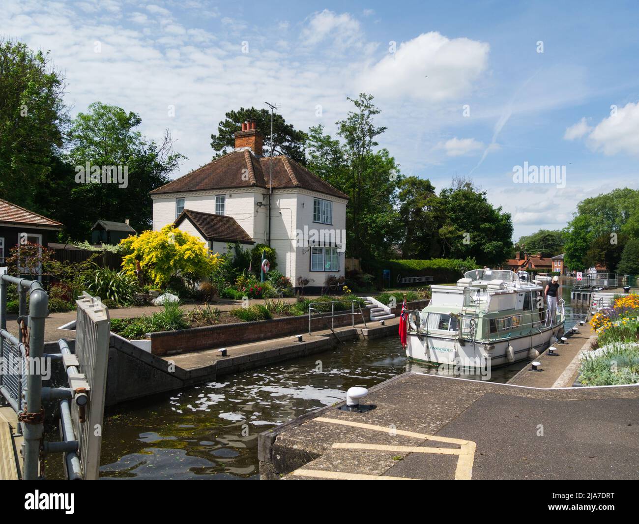 River cruiser in Marlow Lock on River Thames Marlow Buckinghamshire England UK with lock filling for boat to travel on to Marlow Stock Photo