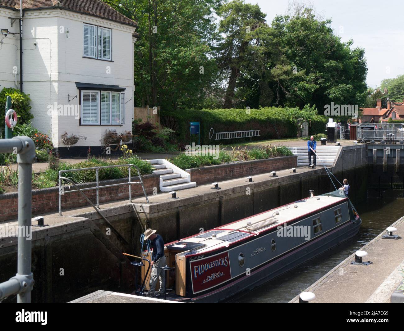 Narrowboat in Marlow Lock with gates closed waiting for lock to fill before proceeding towards Marlow Buckingham England UK Stock Photo