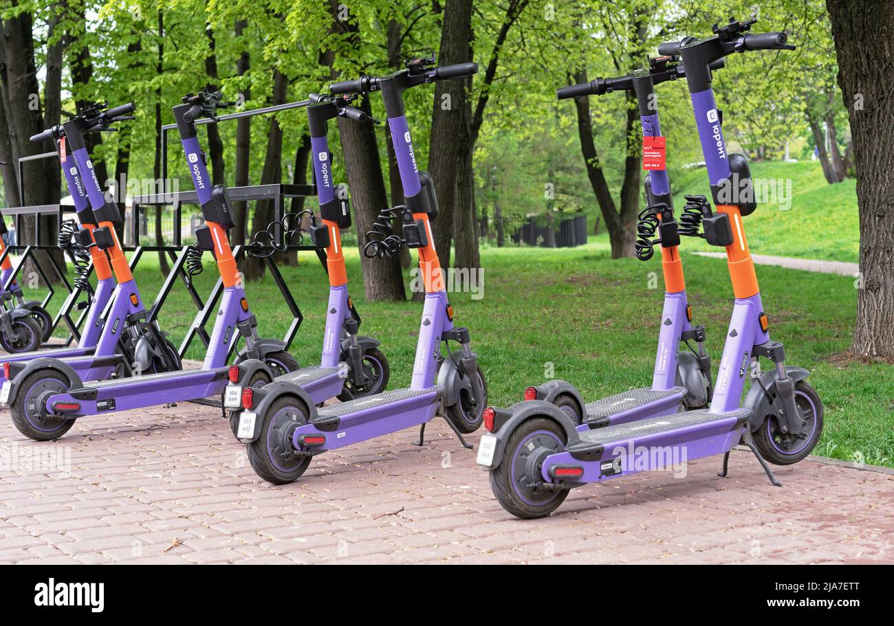 MOSCOW, RUSSIA - MAY 19, 2022: Electric scooters for city rental are in the parking lot. Stock Photo