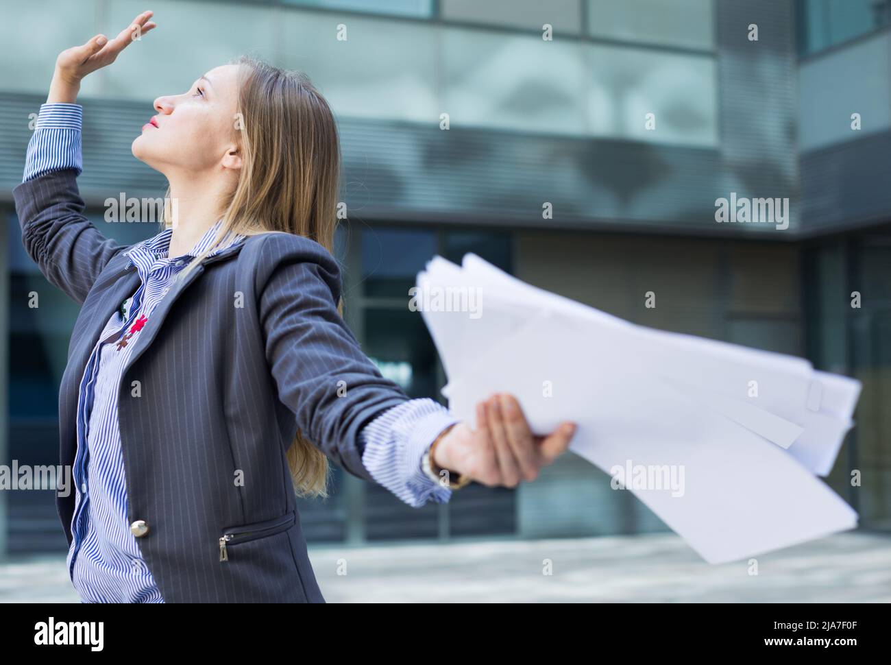 Professional woman in jacket working with documents Stock Photo