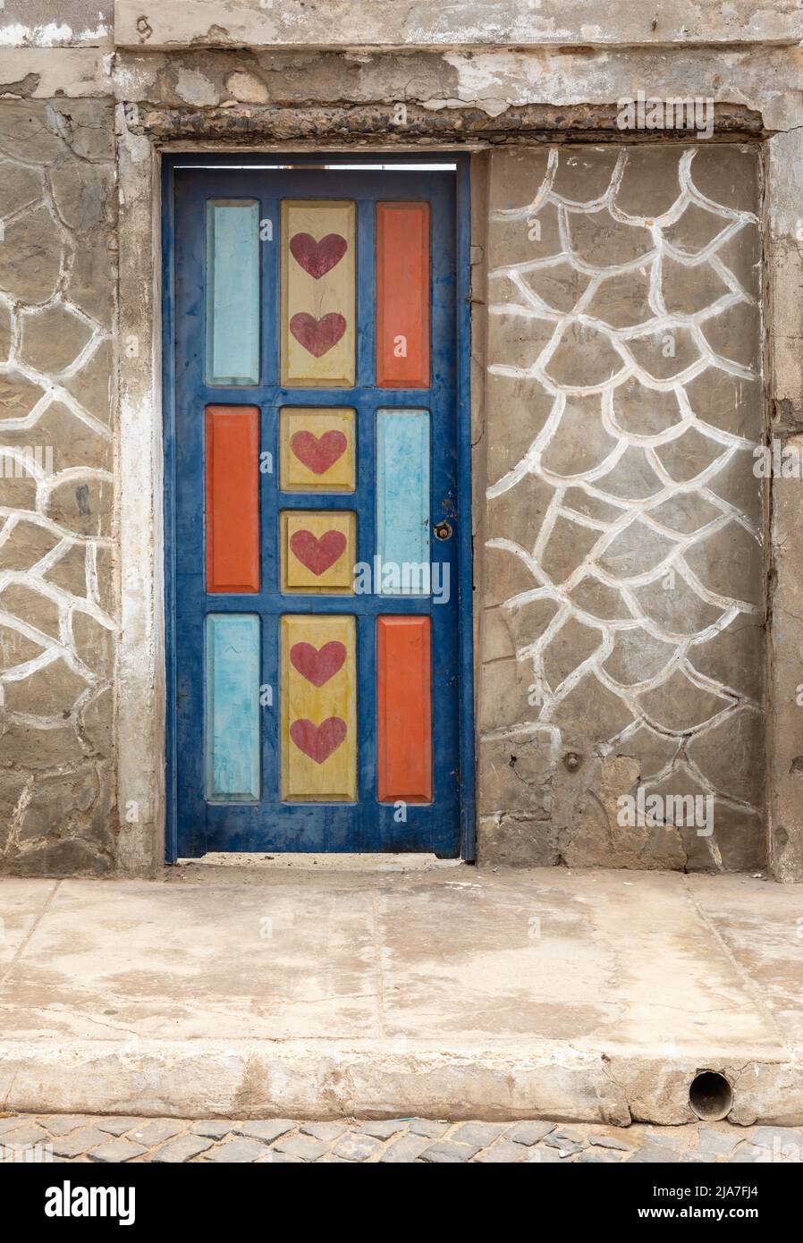 Close up of a pretty colourful painted door with hearts painted on in Santa Maria, Sal, Cape Verde Island, Cape Verde Islands, Africa Stock Photo