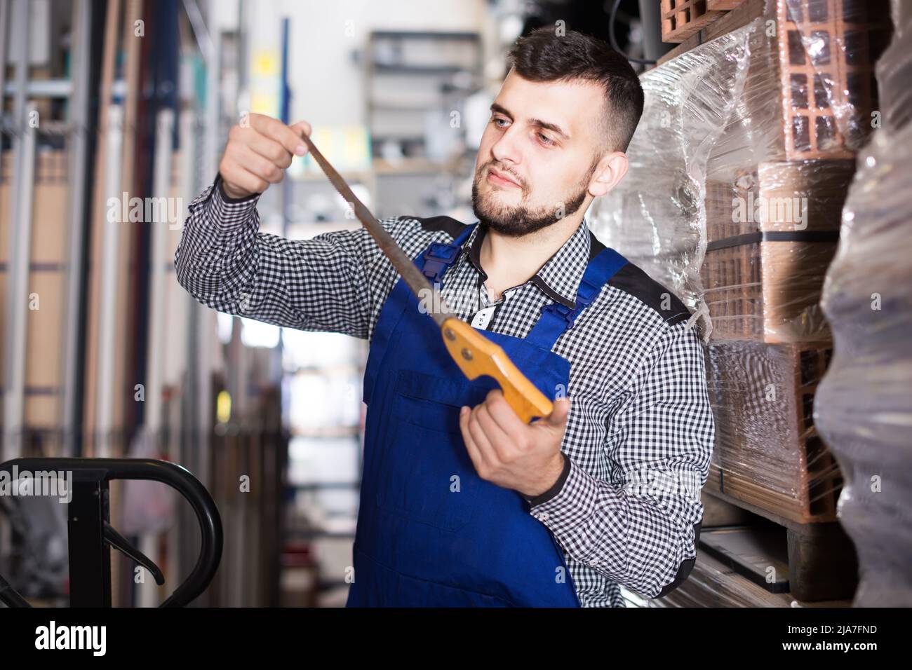 Worker checks the tool before working Stock Photo - Alamy