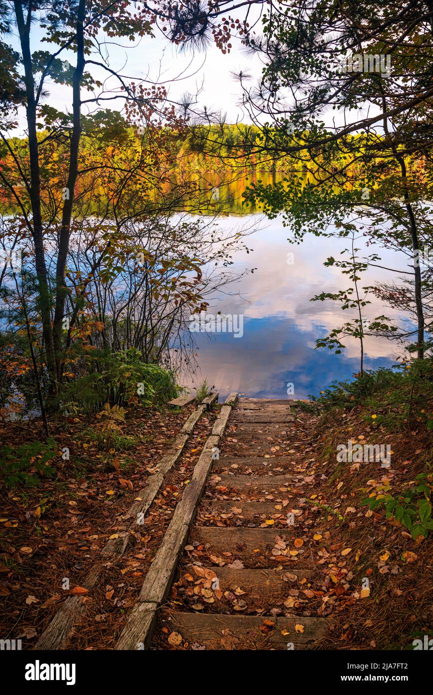 Autumn sky and foliage reflected in Moccasin Lake, Hiawatha National Forest, Michigan Stock Photo